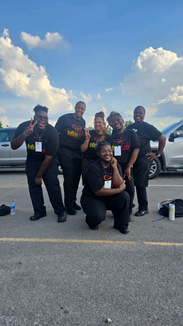 The 2 Girlz and A Tray crew gathered together after an event