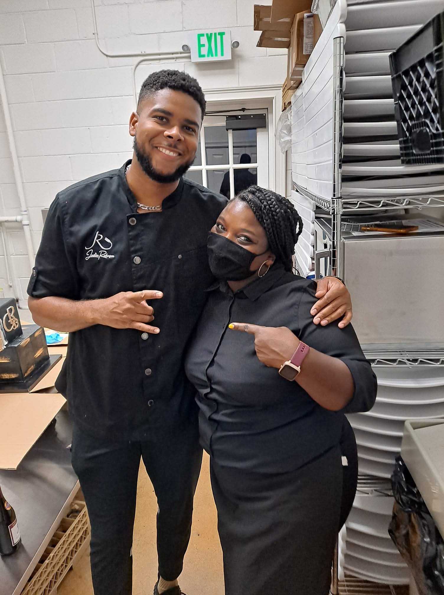Two team members sharing a moment behind the scenes at a venue