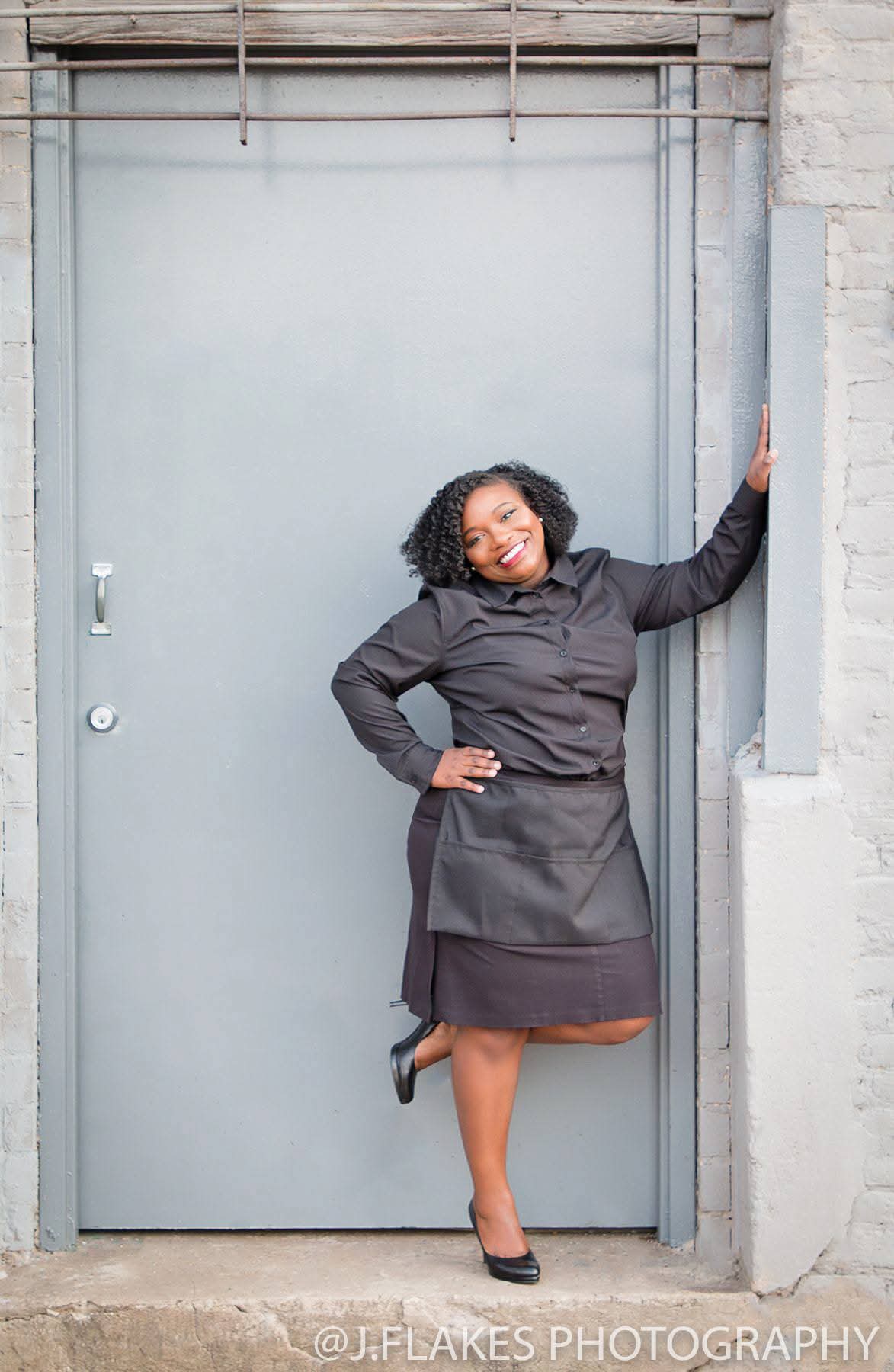 Judy Langford, founder of 2 Girlz and A Tray, in full-length professional service attire