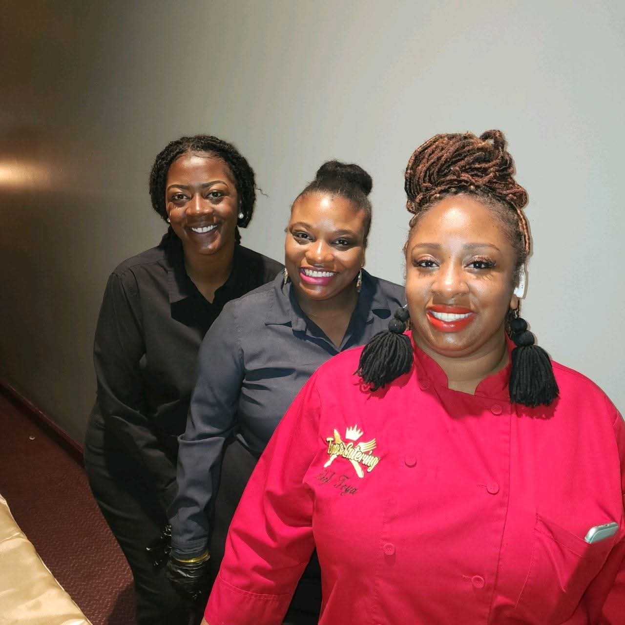 Judy Langford with two team members before service begins